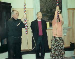 The vicar shows the bishop the bells